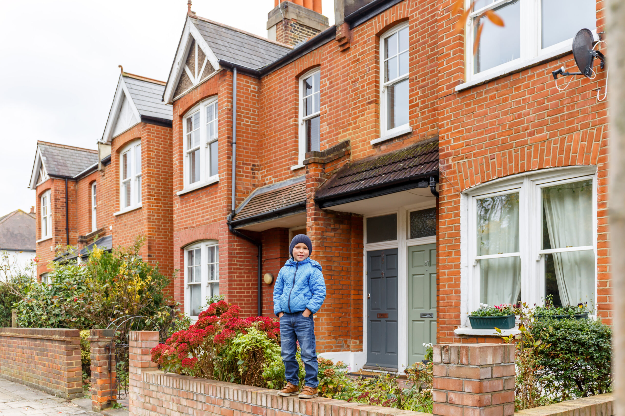 Boy in suburb street in autumn